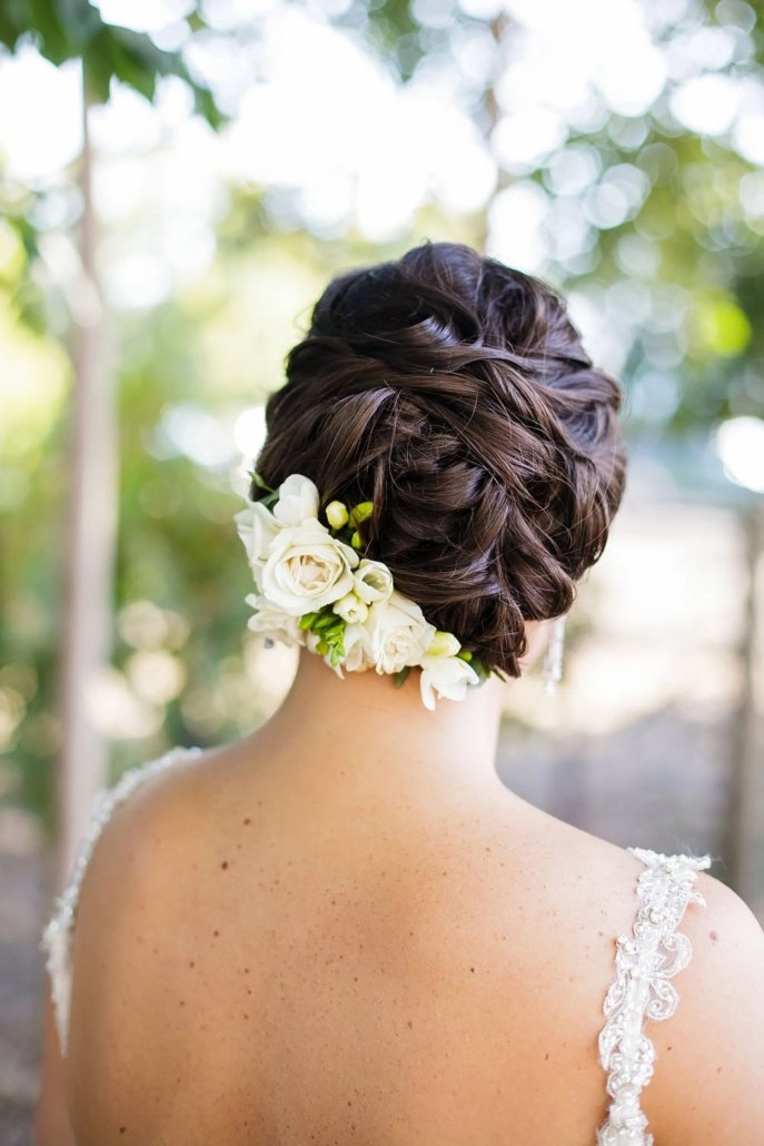 Bridal updo with white florals