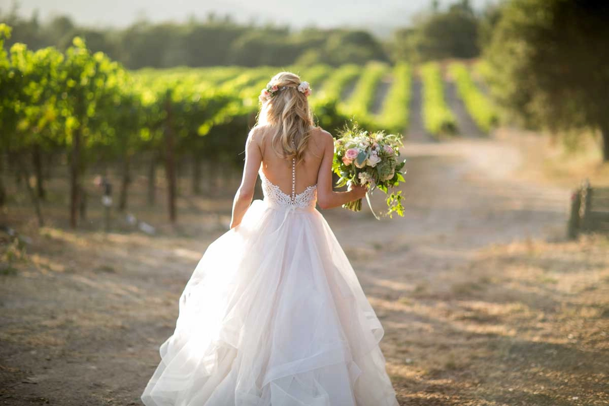 Bride with garden bouquet in a Napa Valley vineyard